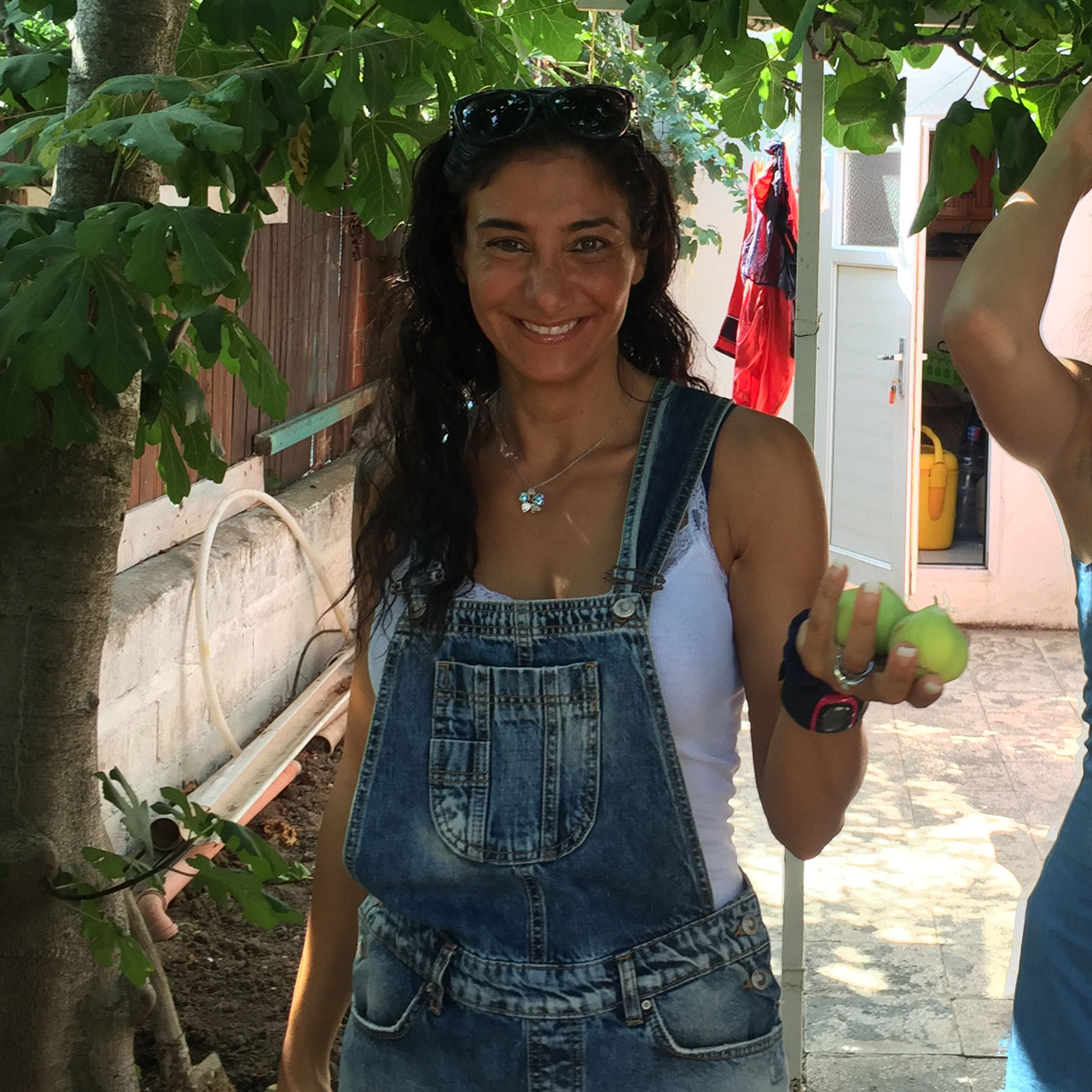 Ayda, founder of Health Angel, smiling in a garden